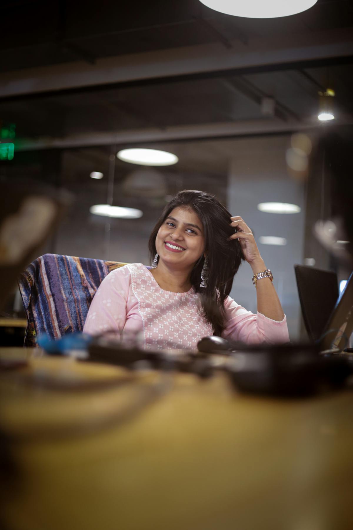 Indian woman smiling in a modern office